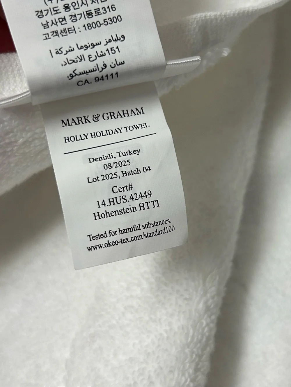 Mark & Graham Holly Holiday hand towel
